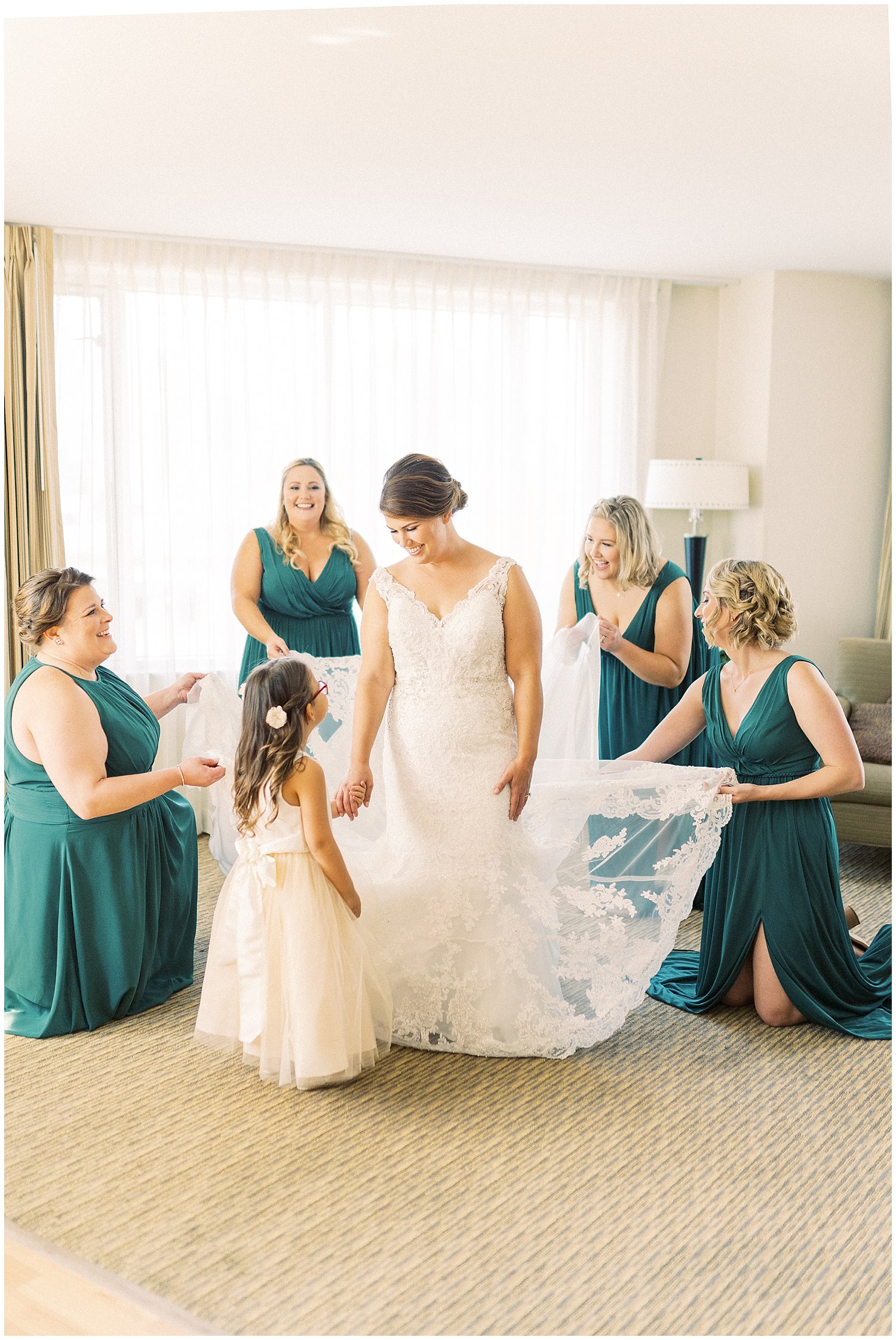 Bride with hunter green bridesmaid dresses from Azazie