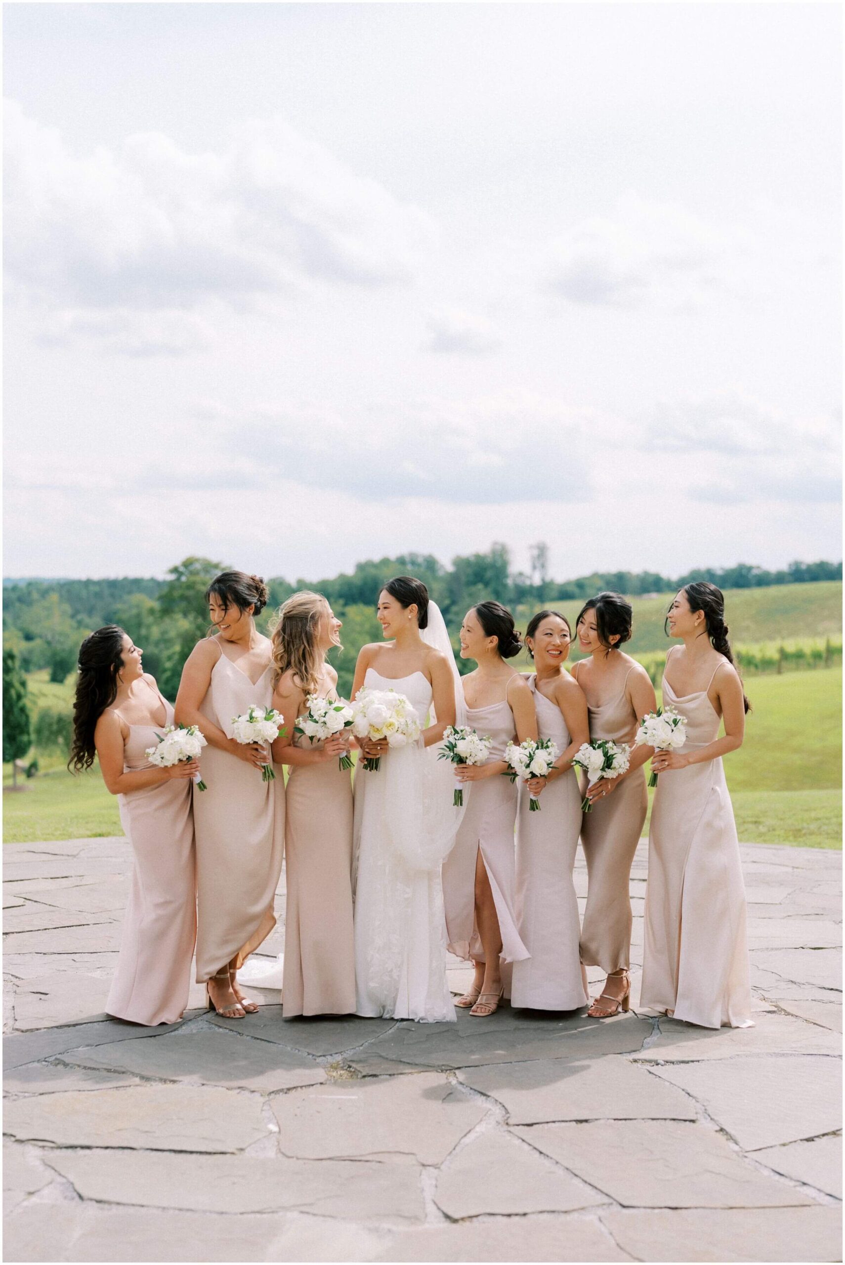Bride and bridesmaids wedding photography on patio at Stone Tower Winery