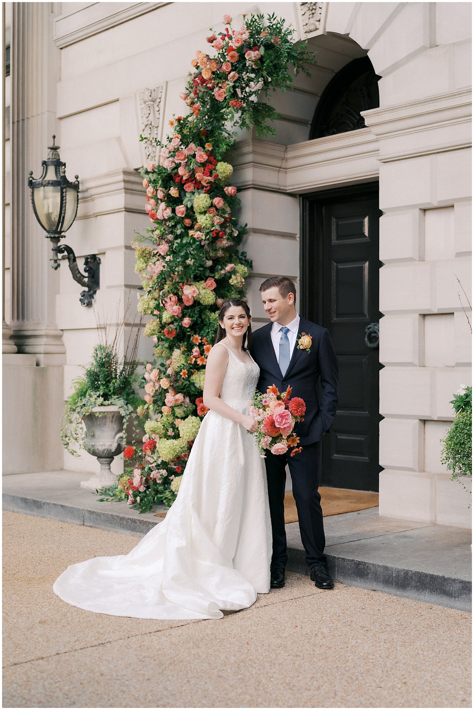 Bride & groom wedding portraits in the front of Larz Anderson House